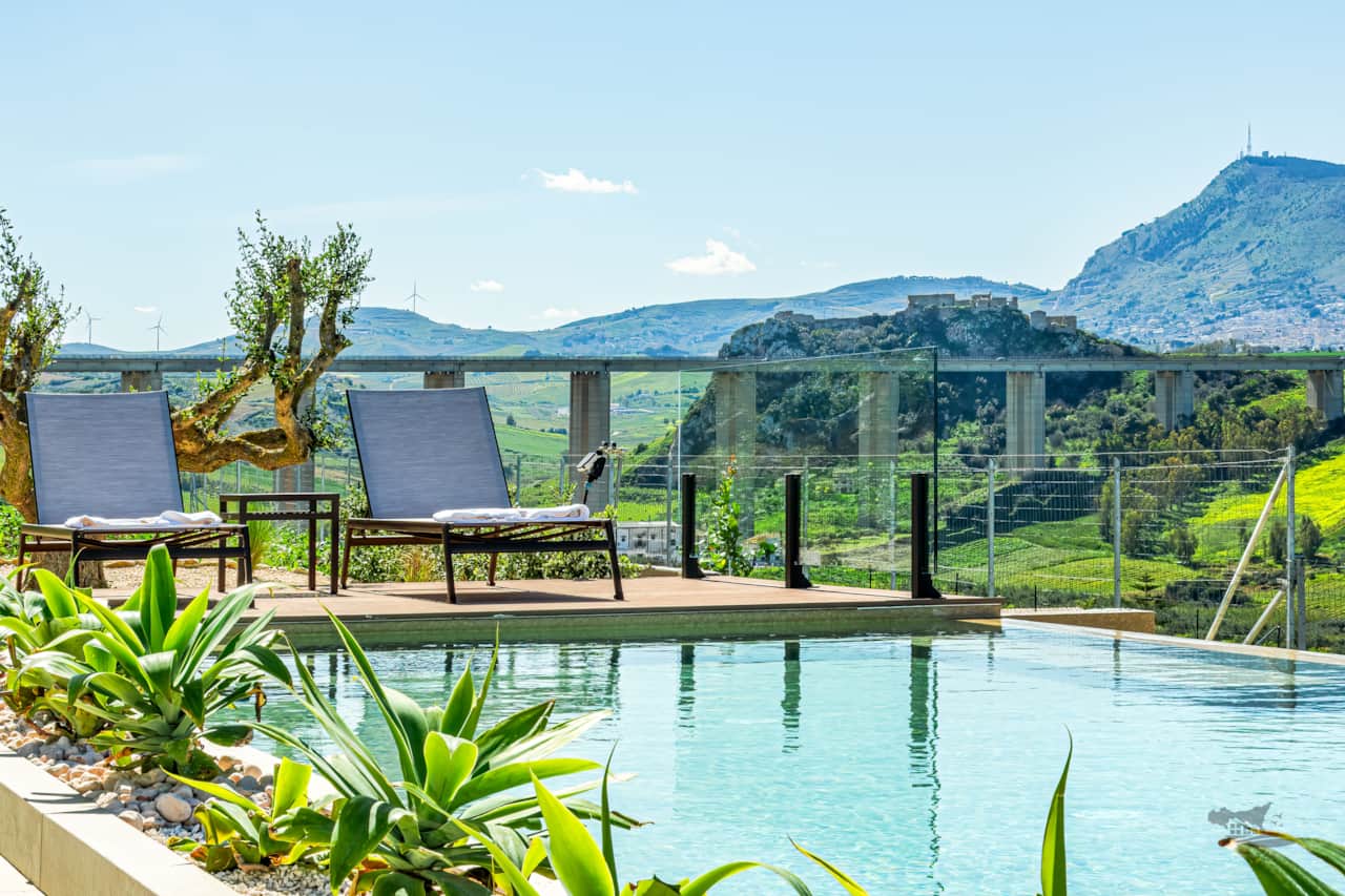 Gaze at the historic Calatubo Castle from the comfort of your sun lounger.