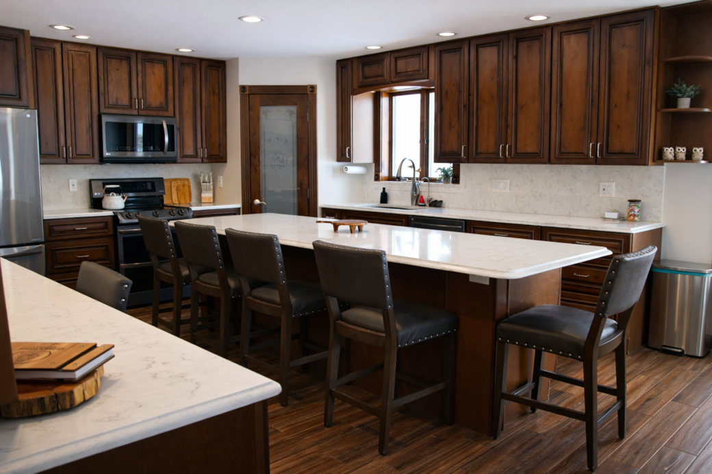 Spacious fully stocked kitchen with large island and seating for gathering. Spacious fully stocked kitchen with large island and seating for gathering.