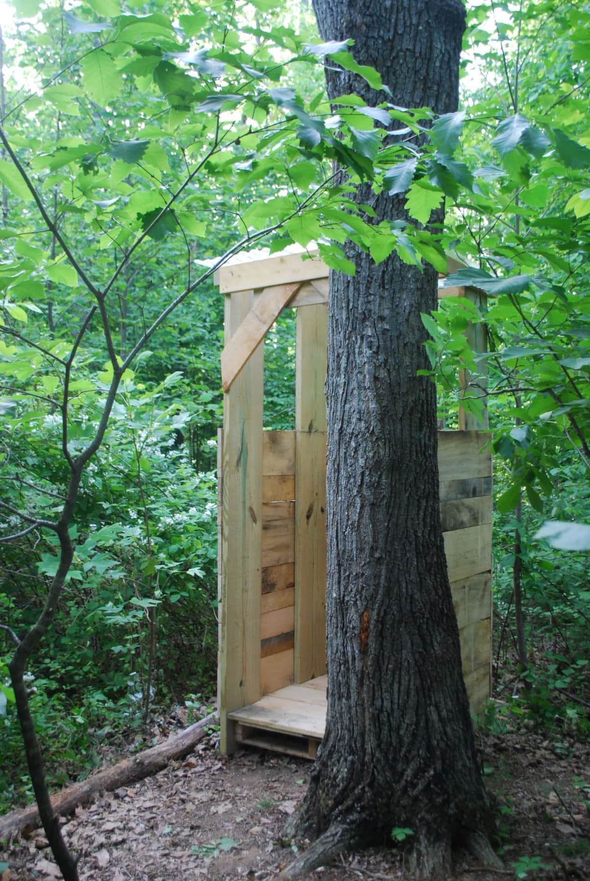 The covered changing area has a portable toilet using biobags