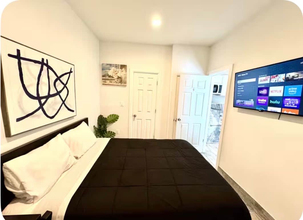 Welcome to this beautiful room! It features a cozy queen bed, small closet, and a flat-screen TV for your entertainment. The decor is both stunning and thoughtfully curated, making it a lovely space to relax and unwind. Enjoy your stay!!