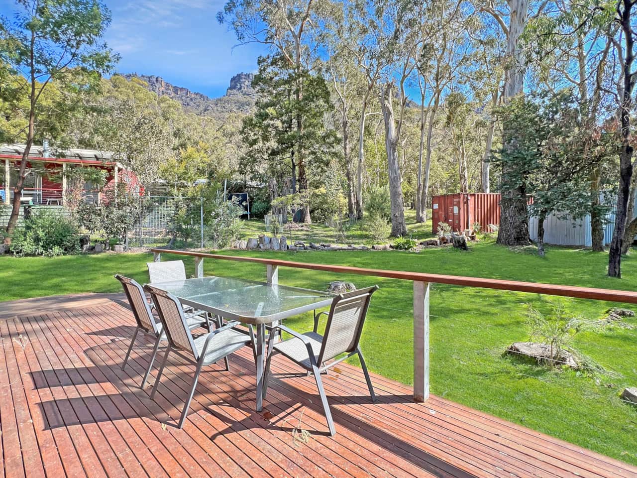 Cottage deck tranquility: Step into a charming outdoor retreat with fresh air and scenic views. 