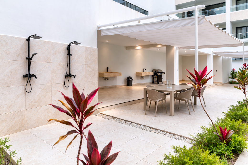 Resort Style Outdoor BBQ, Dining Patio, and Poolside Showers