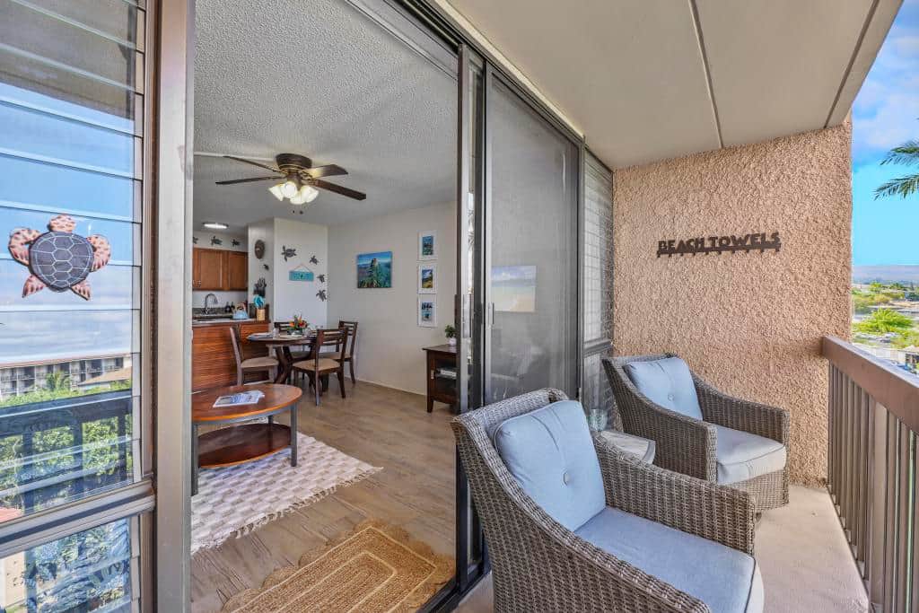 Lanai with comfy rocking chairs and patio table.