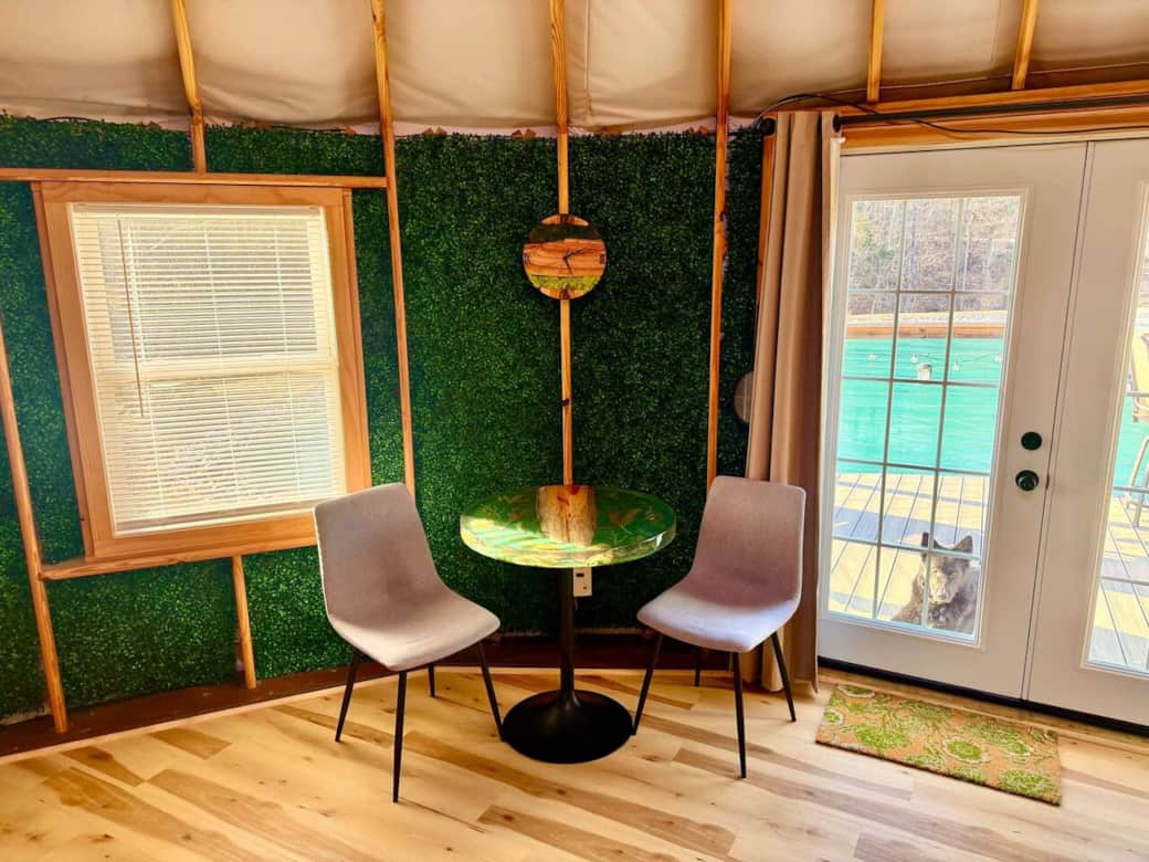 Dining area with custom table made from tree trimmings from around the property