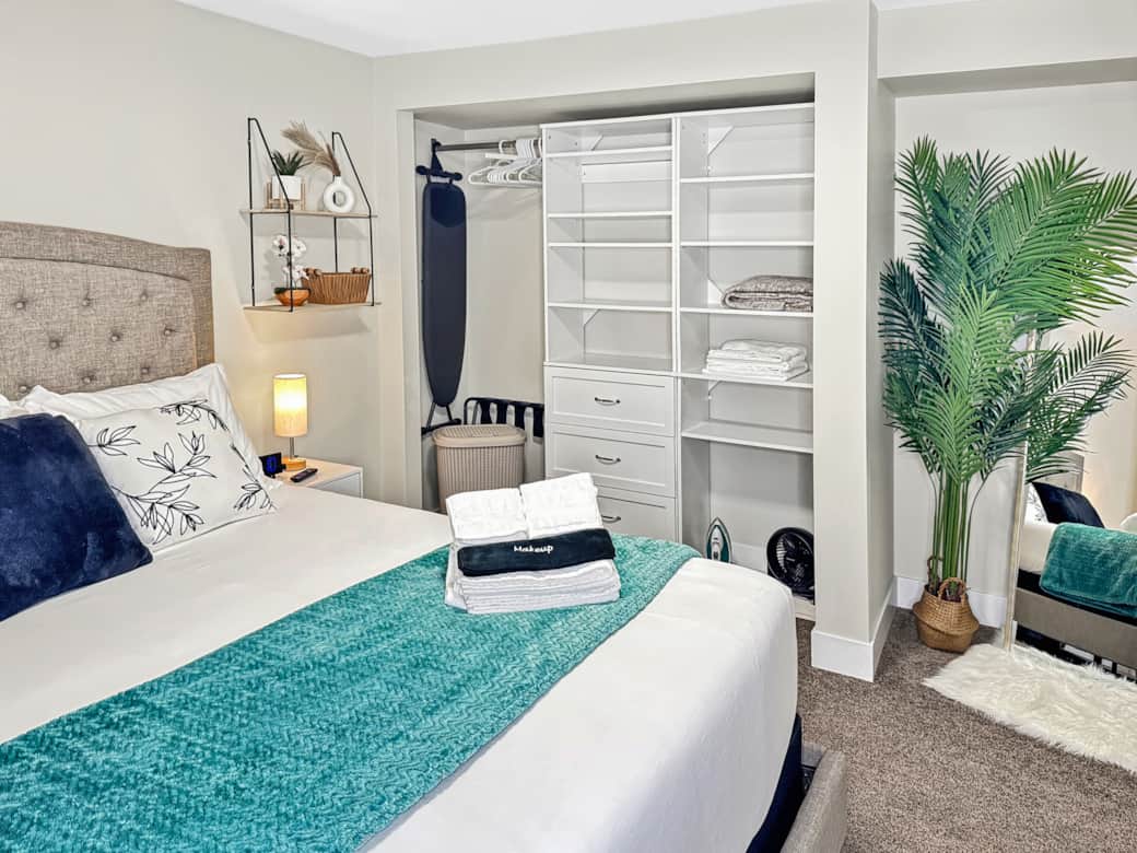 Modern Bedroom with Organized Closet and Cozy Decor