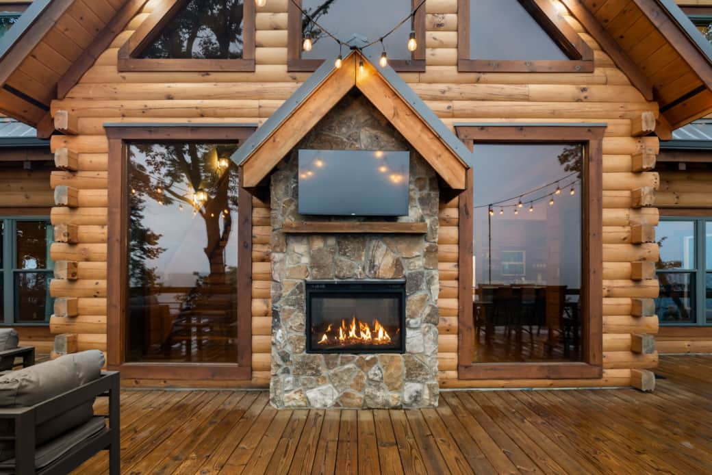 Outdoor TV and fireplace on large back deck