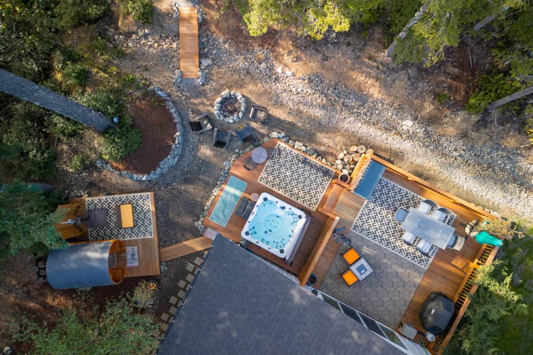 Overhead view of the backyard, hot tub, sauna shower and grill!