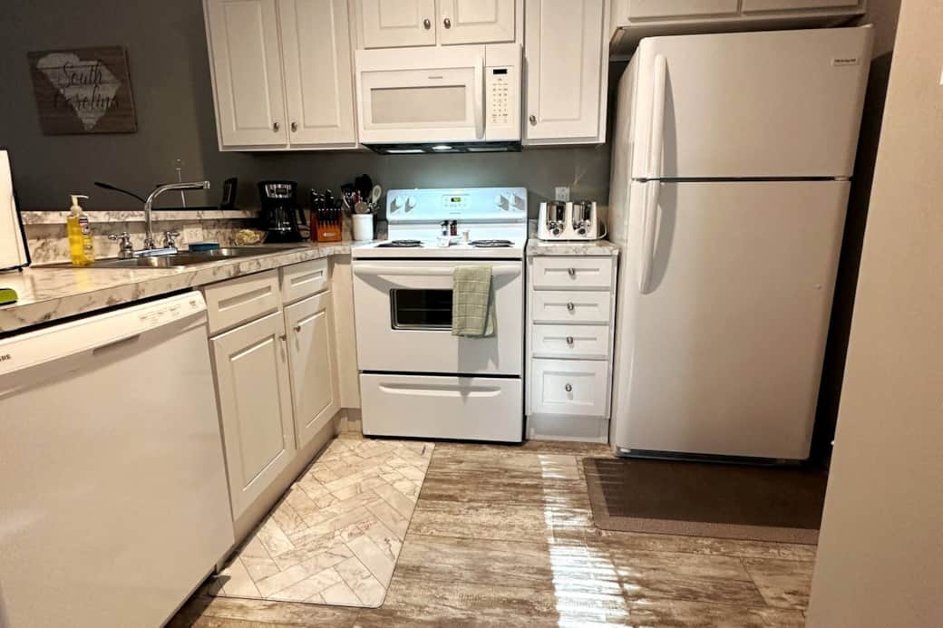 The kitchen includes Microwave, Dishwasher, and Keurig coffee maker with all the essentials.  