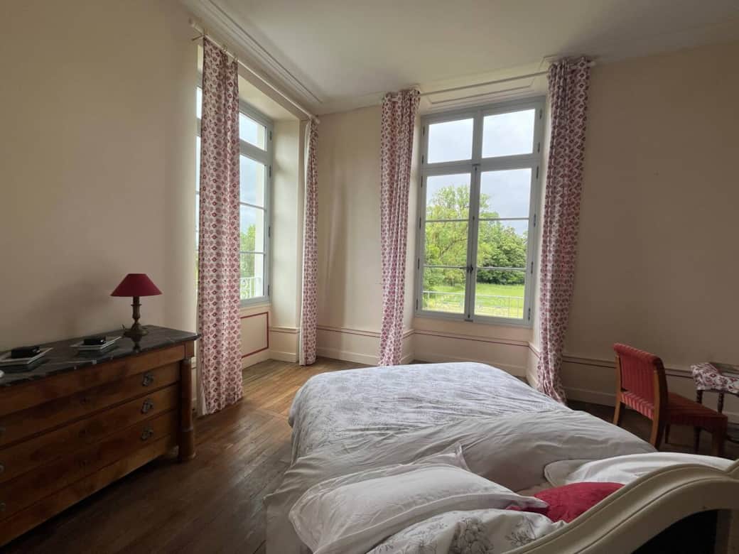 Large room overlooking the French gardens to the left and the meadows and forests to the right. 