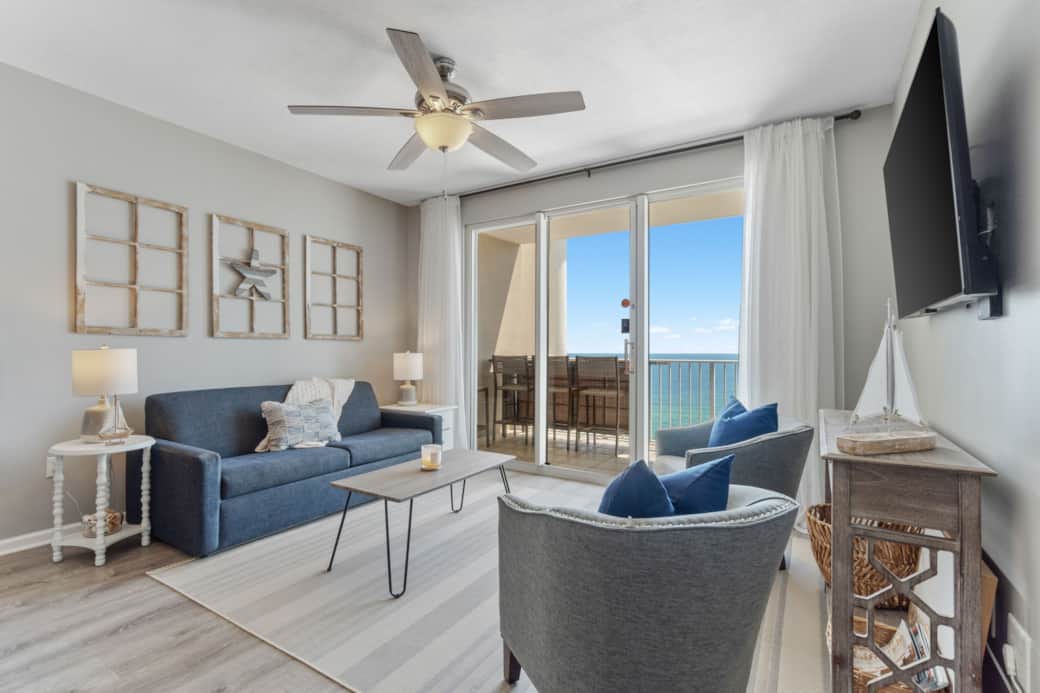 Open living room with smart TV & balcony—stream, relax, and soak up the view.