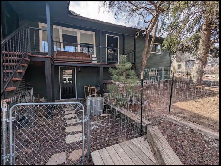 Front of Parker's Den with Fenced yard Front of Parker's Den with Fenced yard