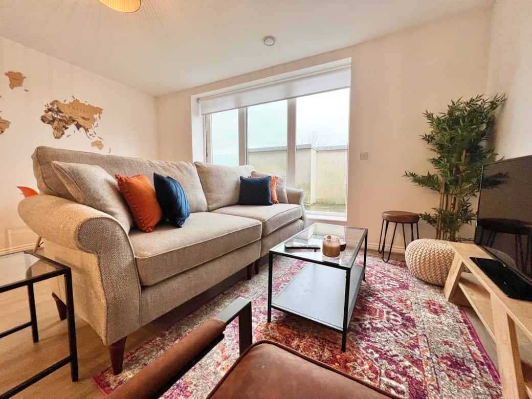 Living Room: Bright space with a comfortable sofa, vibrant decor - perfect for relaxation