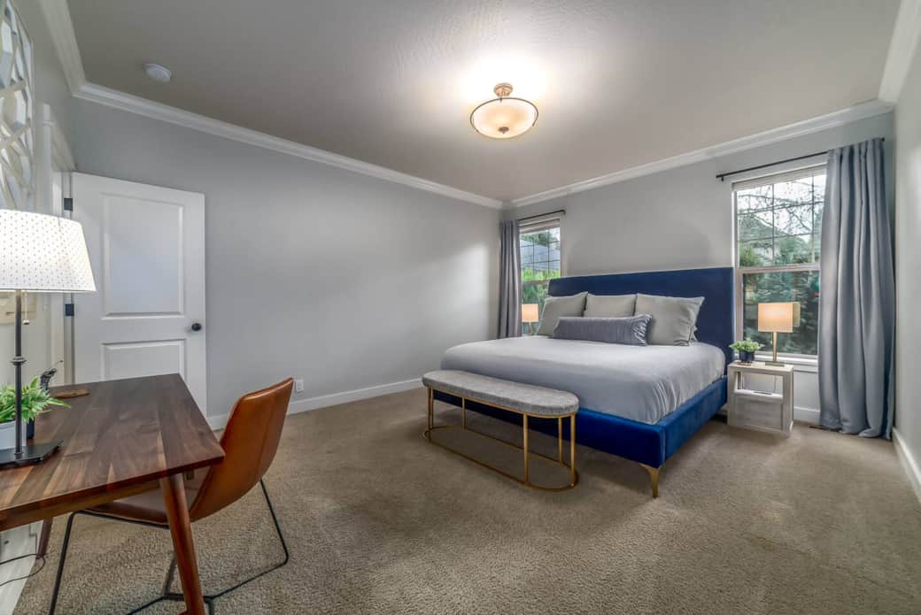 Primary bedroom with king size bed and private workspace.  Large closet and private bathroom available in this room.