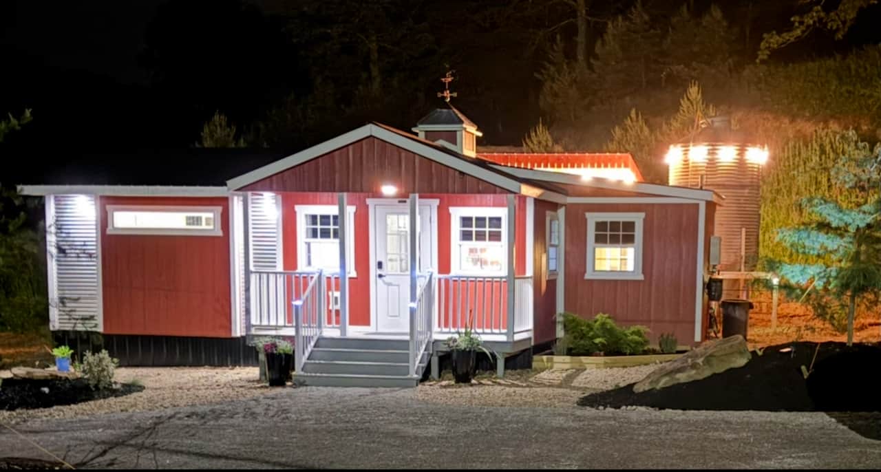 Cozy illuminated cabin exterior at night Private and Peaceful southern Ohio Cabin 