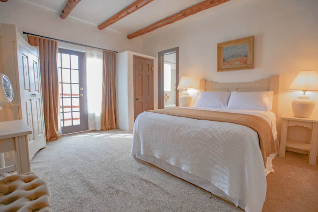 Wardrobe with drawers and closet for hanging clothes with a suitcase stand.