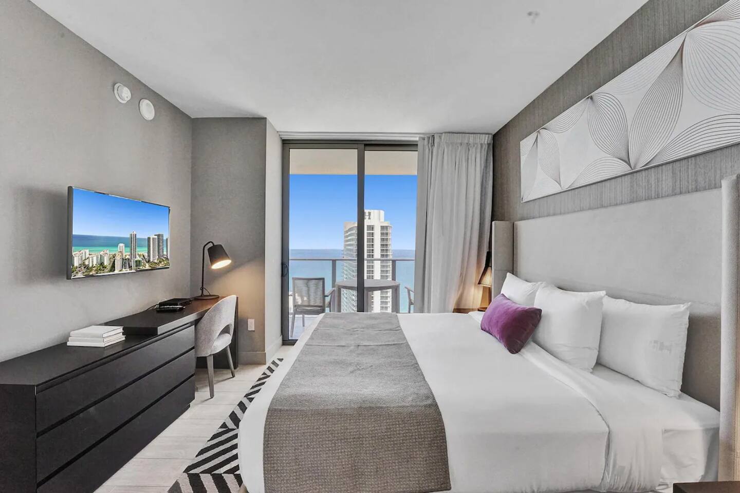 1st bedroom with king bed with ocean view