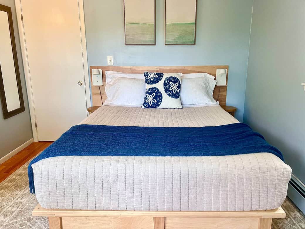 New queen mattress, and updated bedroom for 2024. 100% cotton sheets, cotton quilt. 

End table, directional light, and USB phone charging shelf on either side of bed. 