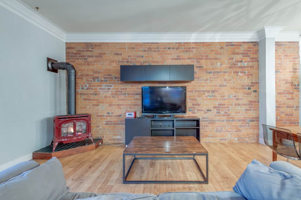 Spacious living area in a North York short-term rental, with modern comforts and a fire place.
