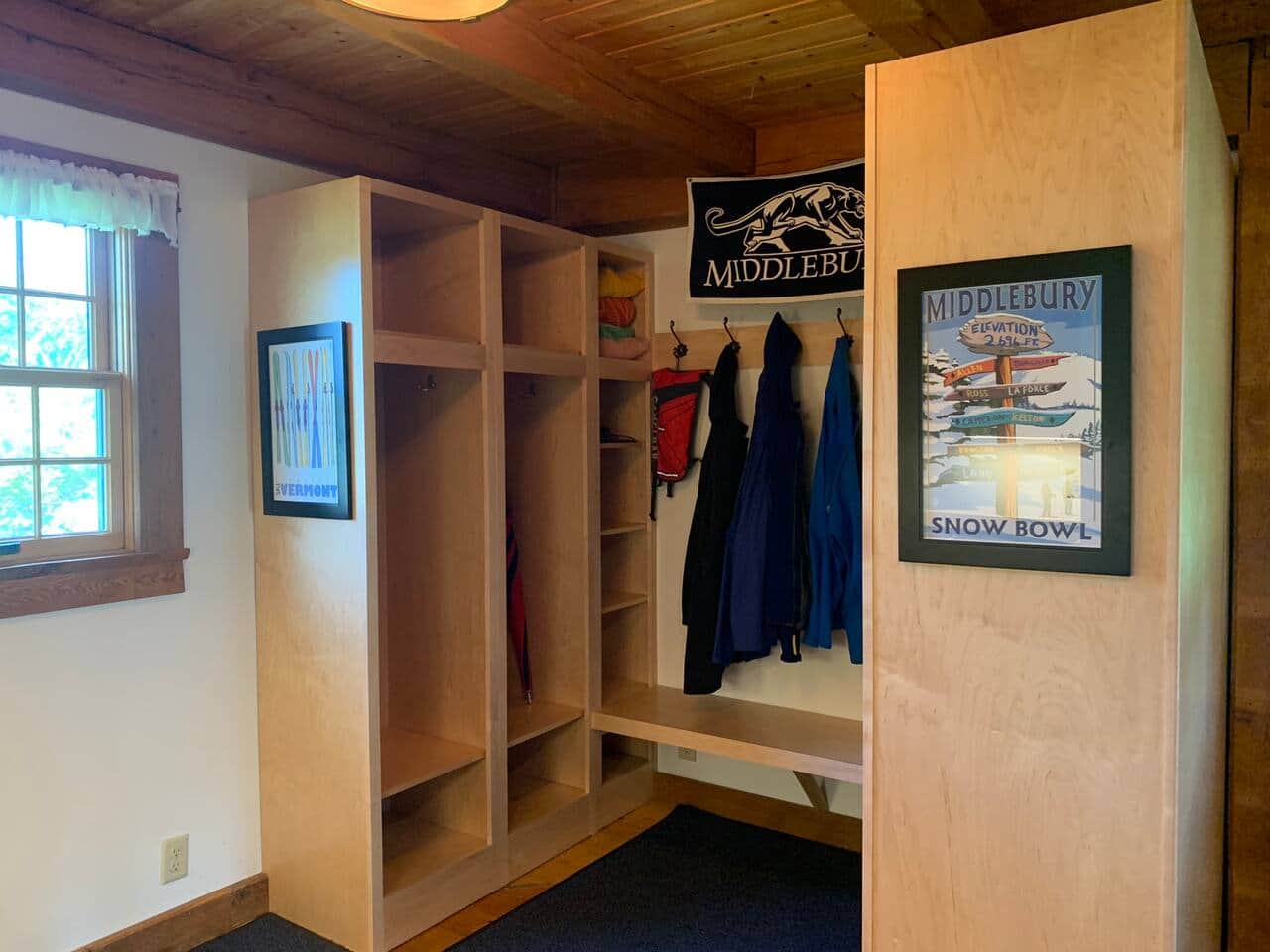 Large mudroom with lockers, wash area, attached to kitchen