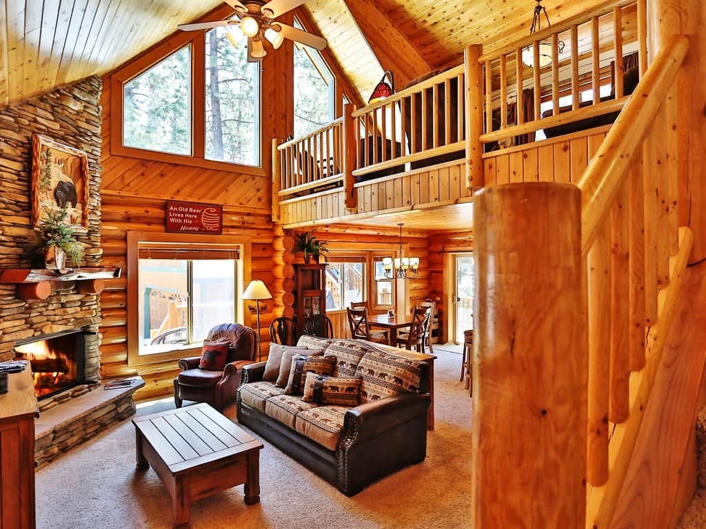 Big Bear is known for its cold evenings and nights, which makes this home such a wonderful respite if you're from a particularly hot region. Beautiful wooden interiors, comfy seating, the cool night air and a roaring fire make this room the perfect p