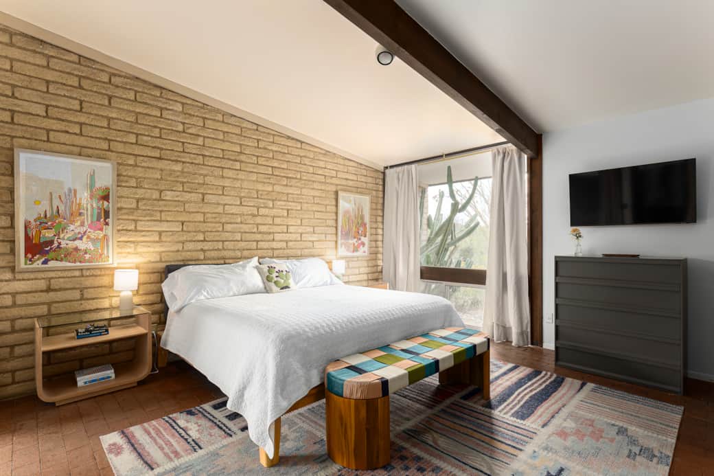 Primary bedroom w/ king bed.