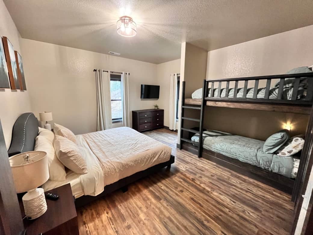 One bedroom along with a king bed also has a bunkbed. 