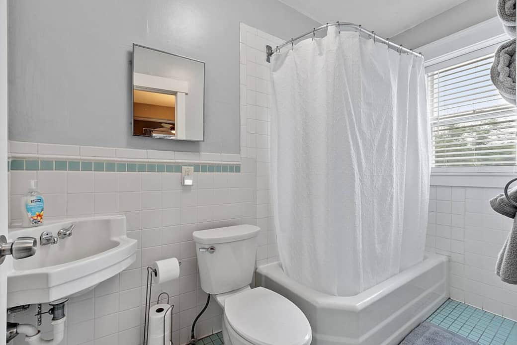 First floor full bathroom with tub/shower combination.