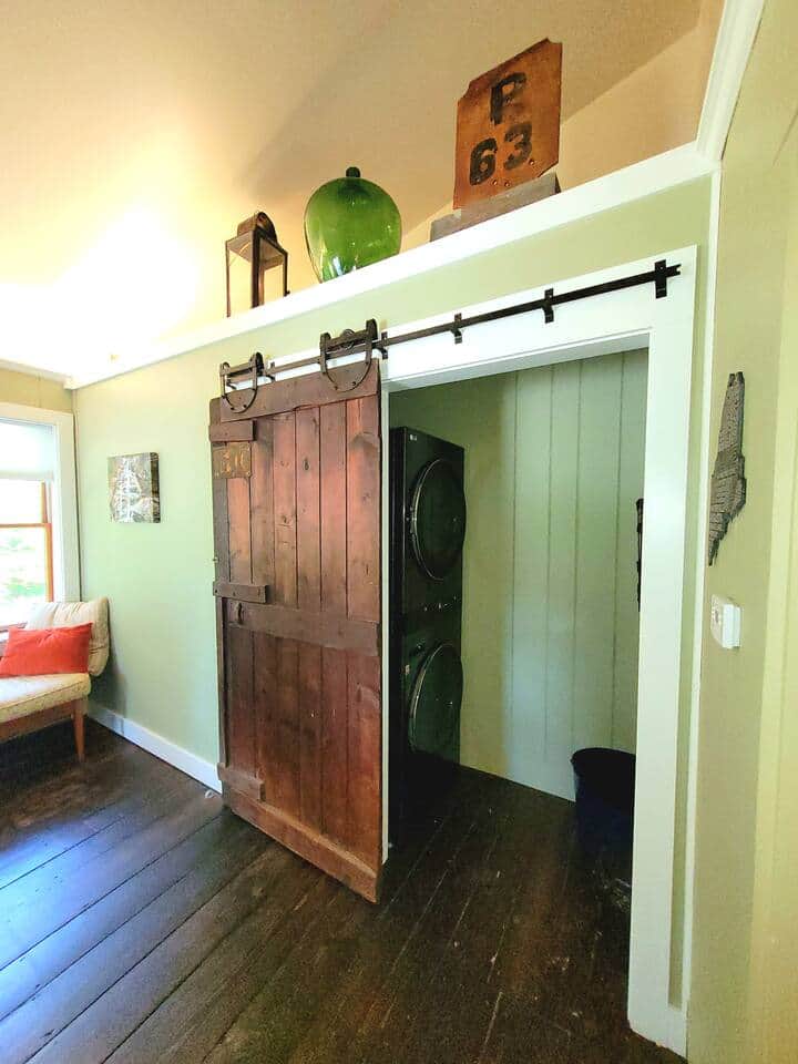 Mud room entry with washer dryer slider open.