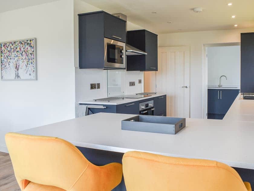 Welcoming breakfast bar and kitchen at Awel y Môr