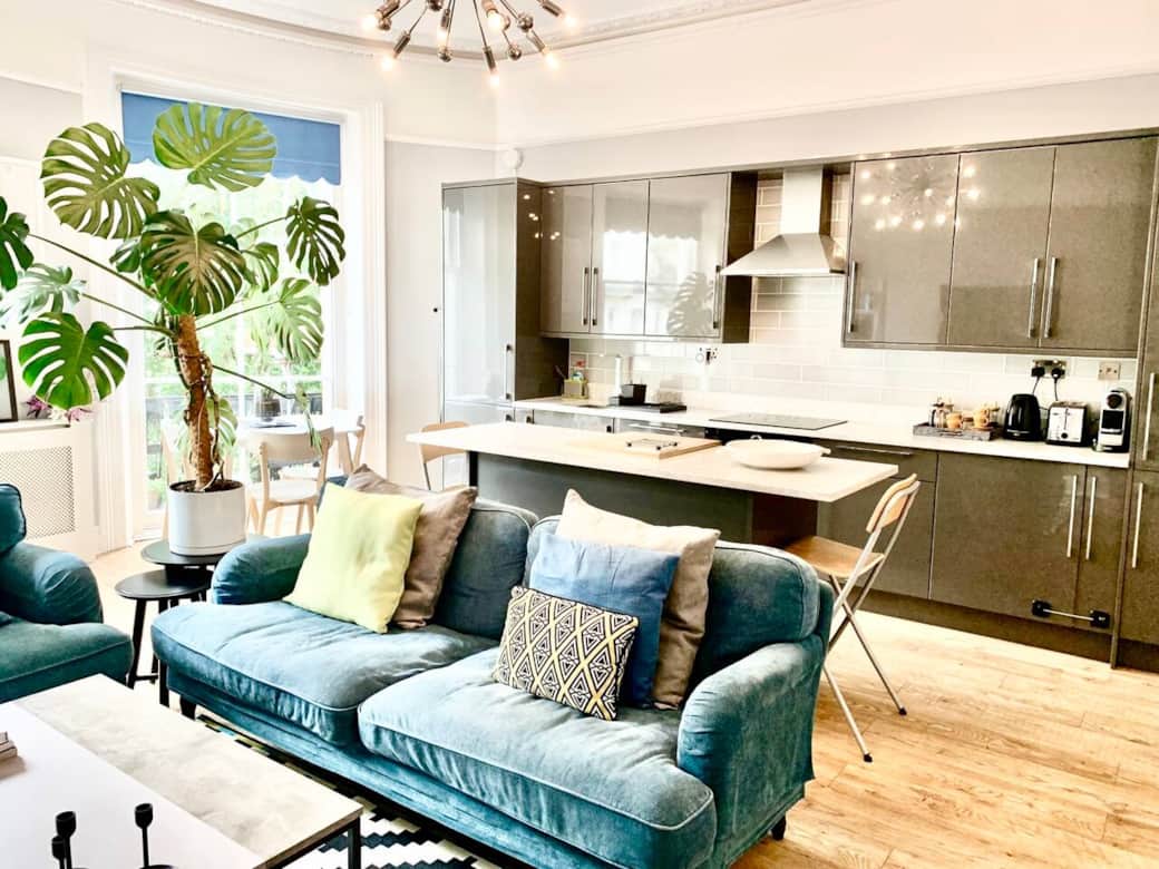 Living Room: The open-plan kitchen/living area is bathed in natural light