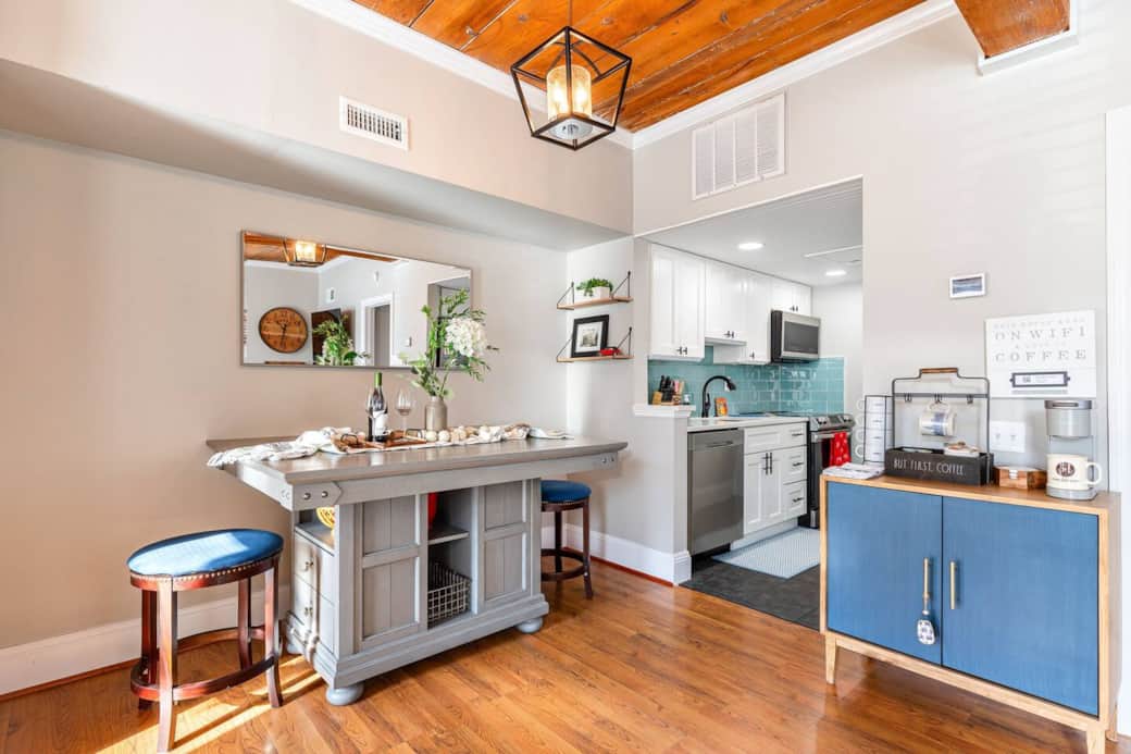 Open floor plan featuring a counter height bar table, coffee bar, beautiful kitchen