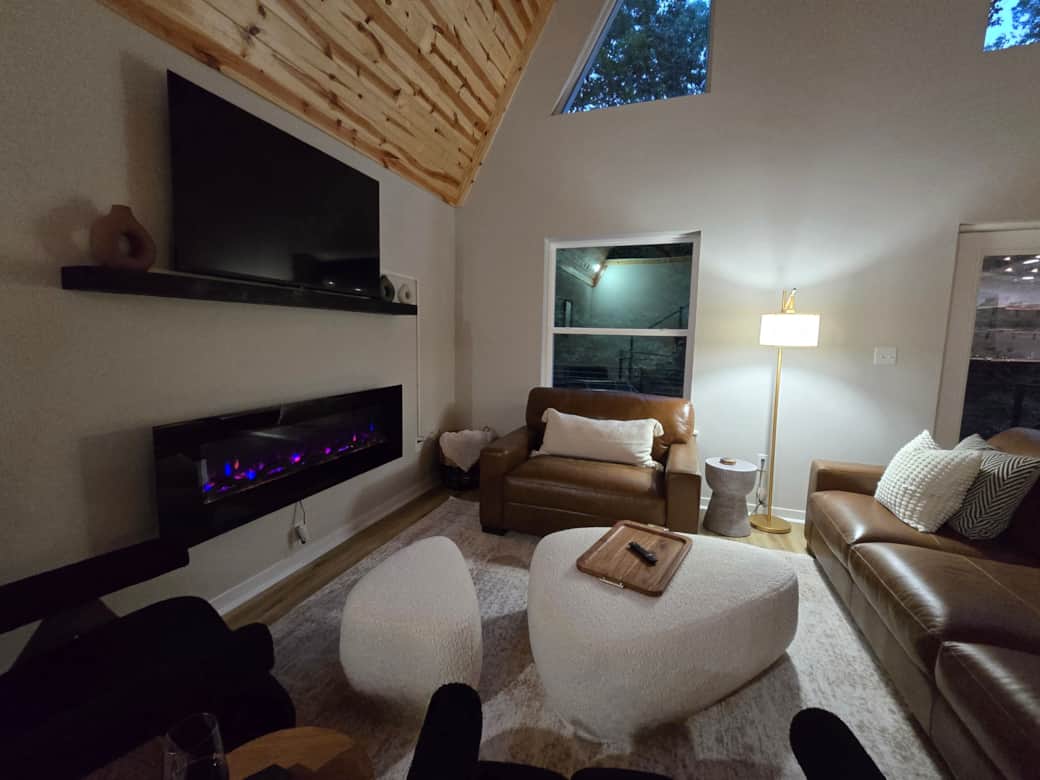 Gather for movie nights beneath vaulted ceilings, or cozy up beside a warm fire.
