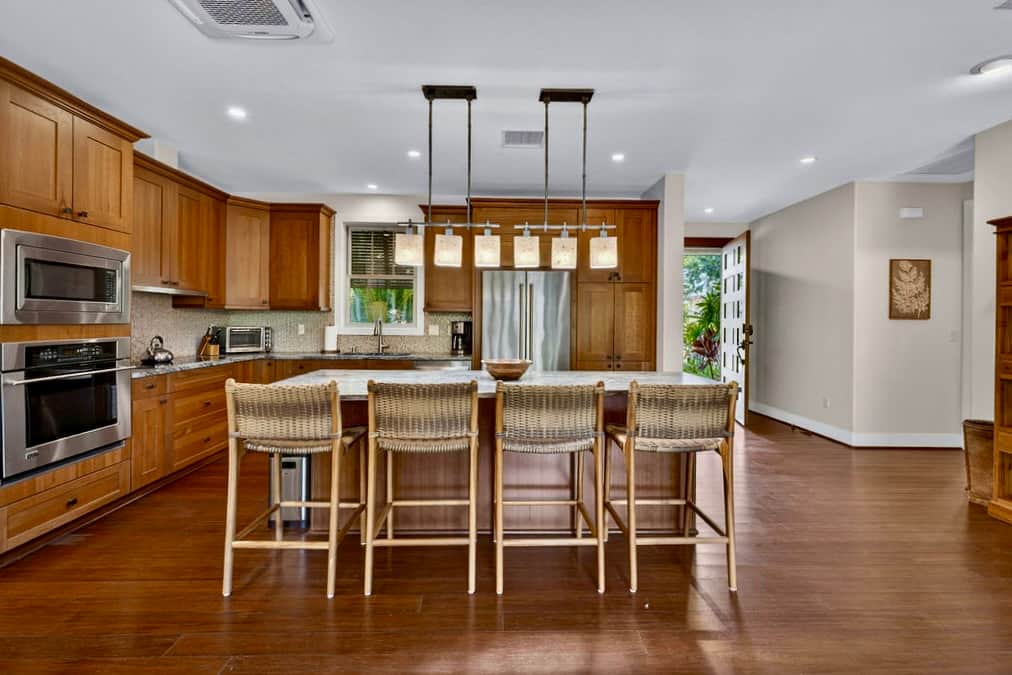 Gourmet kitchen with island seating. Cook, gather, enjoy.