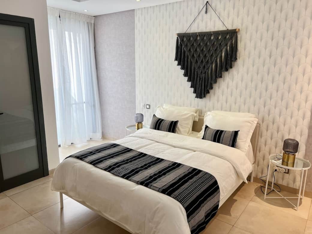 Step into a dreamy paradise in our first bedroom, where cozy textiles and unique decor blend seamlessly to create a magical atmosphere.