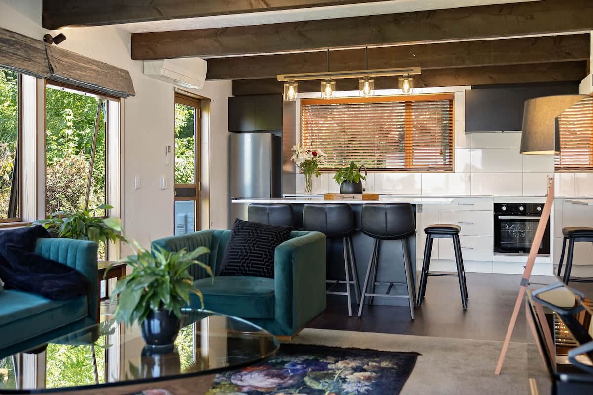 Modern kitchen and dining area at Walk to Town 39A Alpine Chalet Queenstown