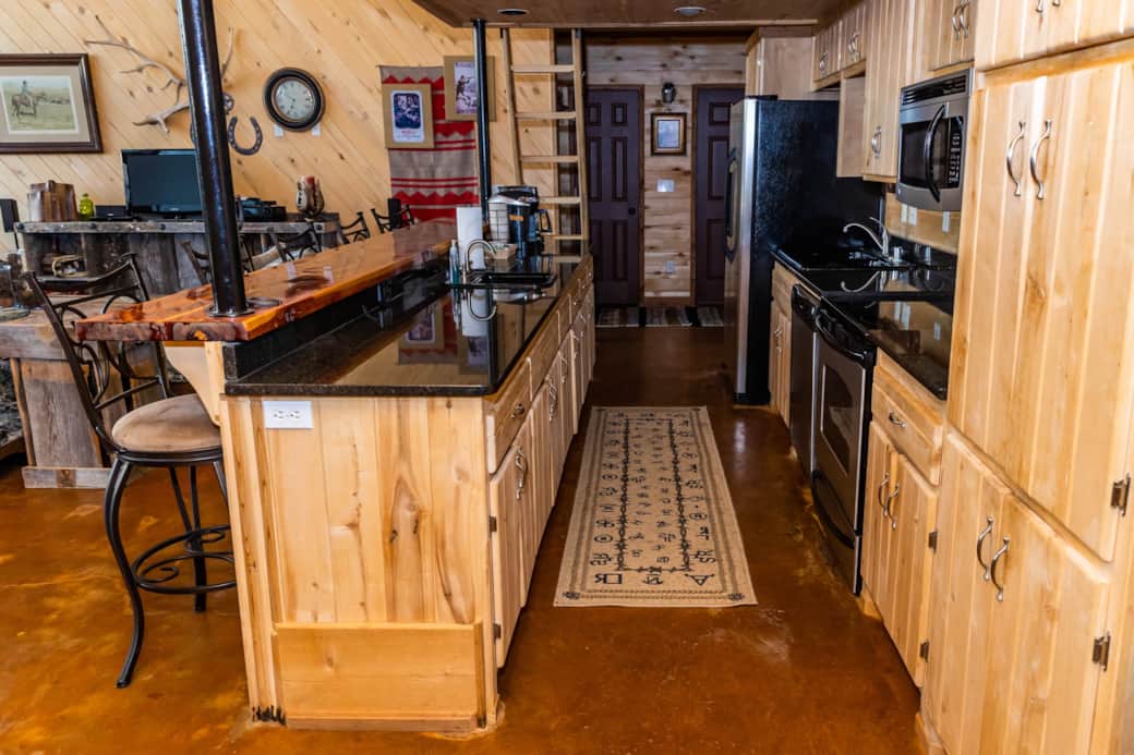Fully stocked kitchen with additional sink is perfect for family meals.