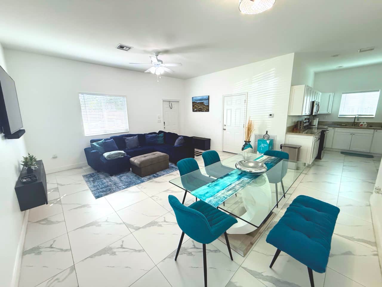 Living: Bright, open living room with Smart TV and comfortable seating for relaxing or entertaining.