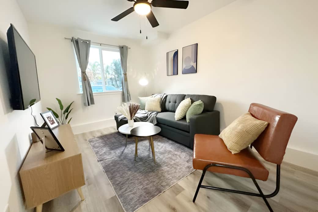 Cozy living room with a comfortable pull out couch. 50 in. smart TV with Roku installed