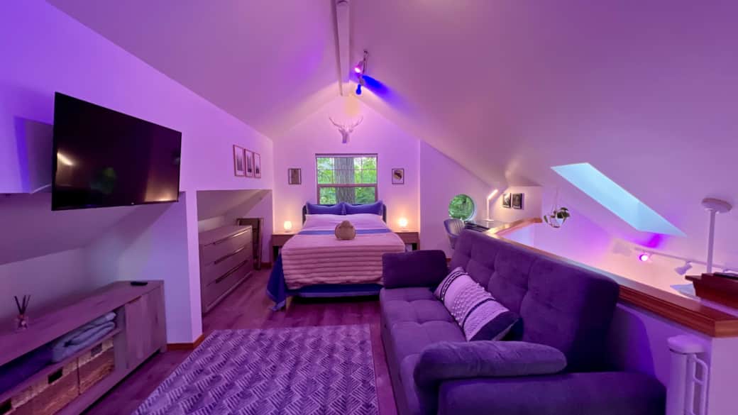 There is extra bedding and blankets in storage bins under the bed.