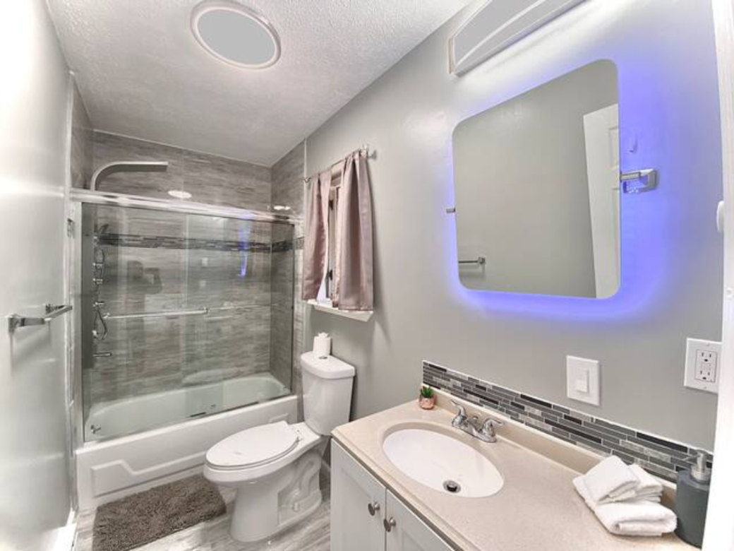 NEW - entirely renovated full bathroom with LED lights in shower & vanity mirror 
