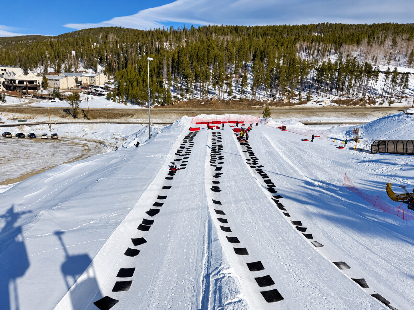 Snow tubing lanes and red tubes at Winter Park Resort