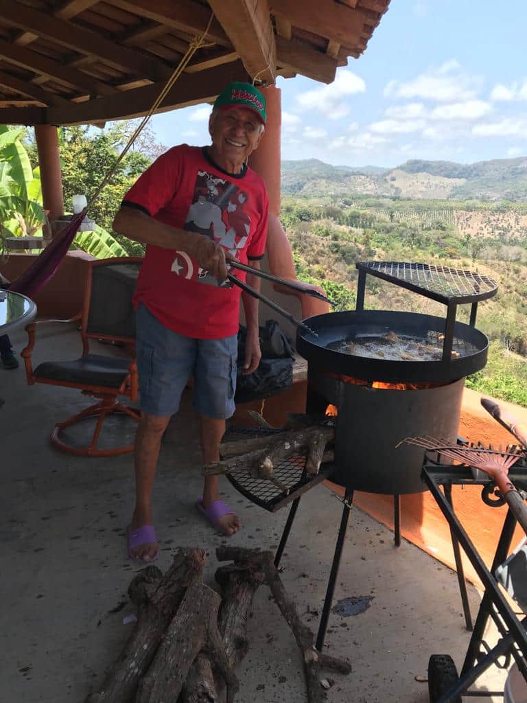 Yazzi's dad grilling over the wood fire barbecue on the La Casa Redonda terrace
