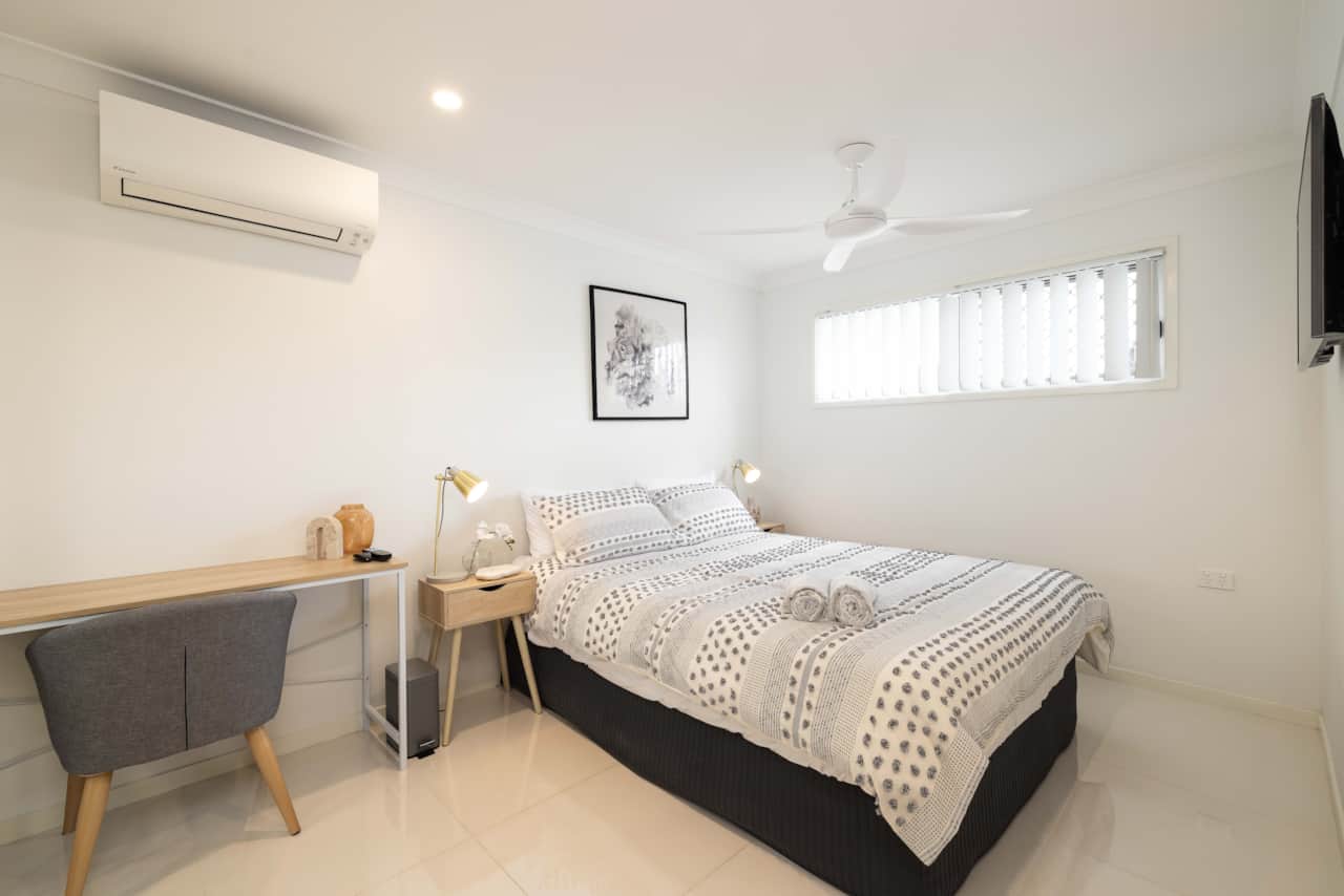Bedroom: Peaceful bedroom with cozy design and ample storage 