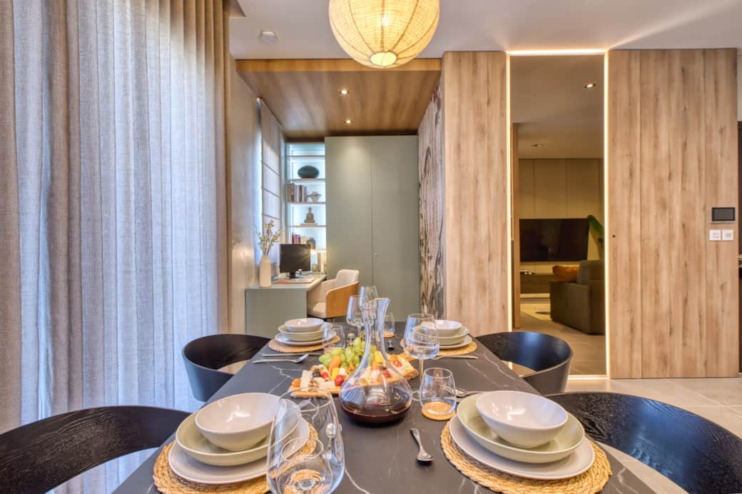 The marble dining table overlooks the study area and seamlessly flows into the living space.