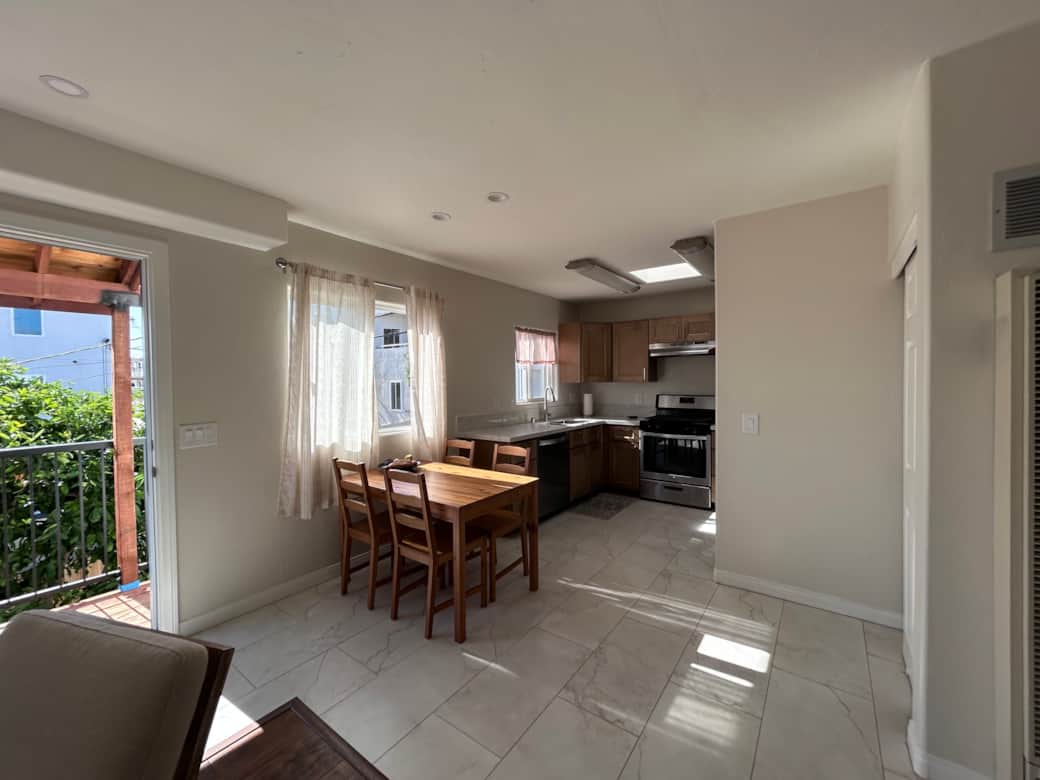 Dining Area Next To Kitchen / Access to Balcony
