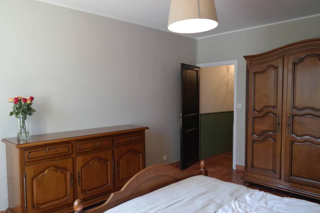 Bedroom 1 with queen bed and air conditioning