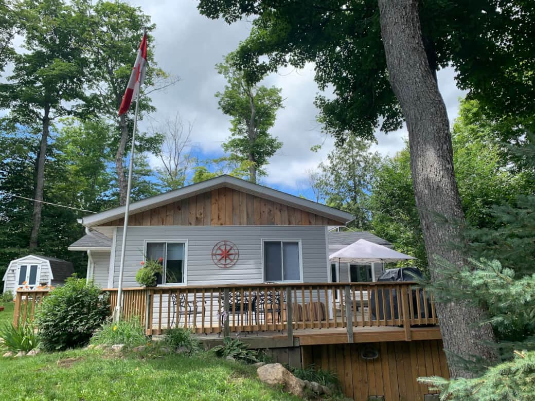Side view of cottage and wrap around deck