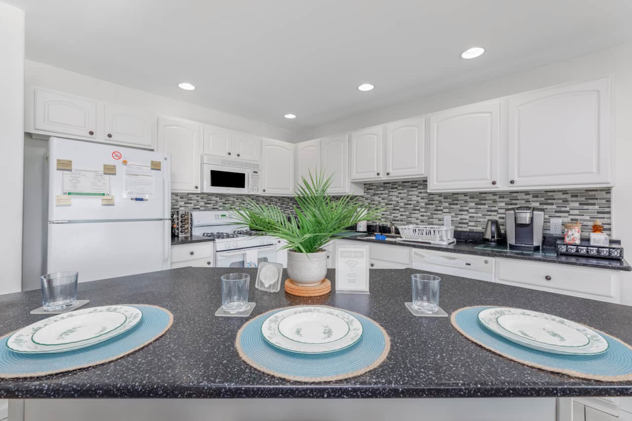 Our kitchen island with 3 bar stools is perfect for easy breakfasts, coffee chats and more!