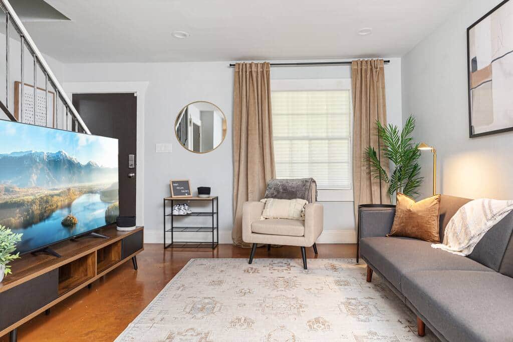 Beautifully appointed modern living room area with 65in smart TV.