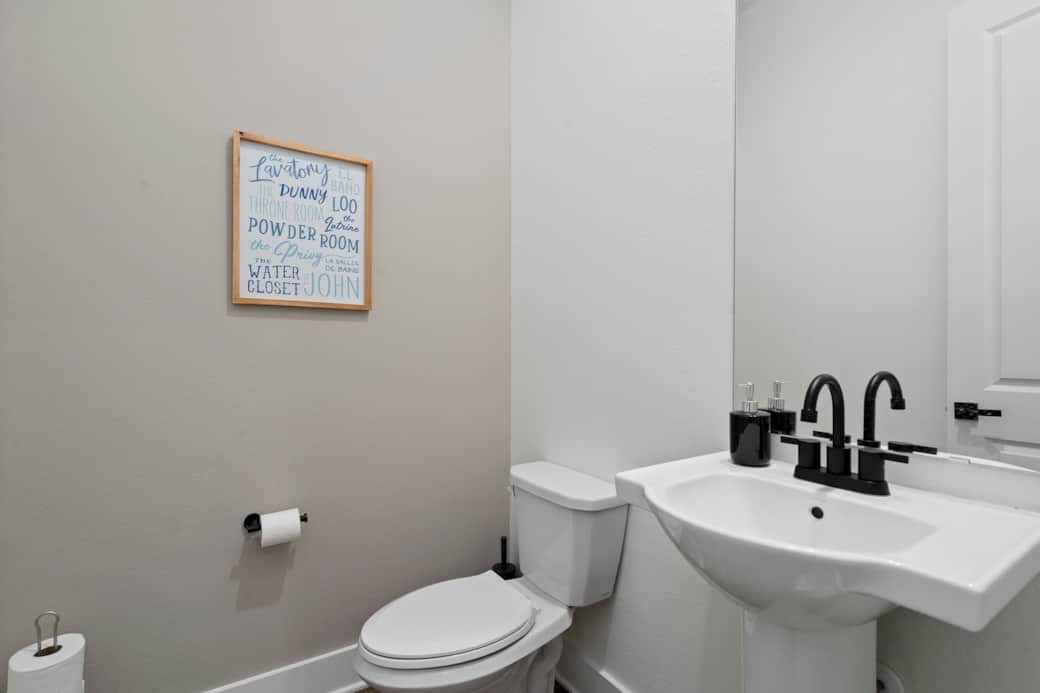Conveniently located half bathroom. Conveniently located half bathroom.